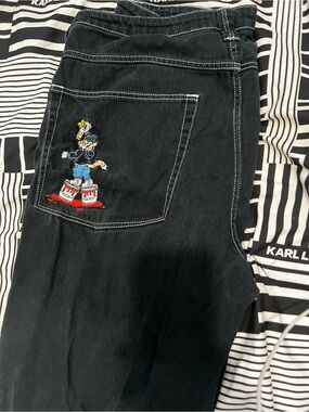 Empyre Black Relaxed Jeans with Embroidered Cartoon Pocket